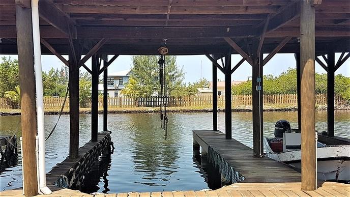 Listing ID: URE0367, Blue Bayou Utila, Bay Islands, HN - Boat Slip and Garage at the Palms, Photo #